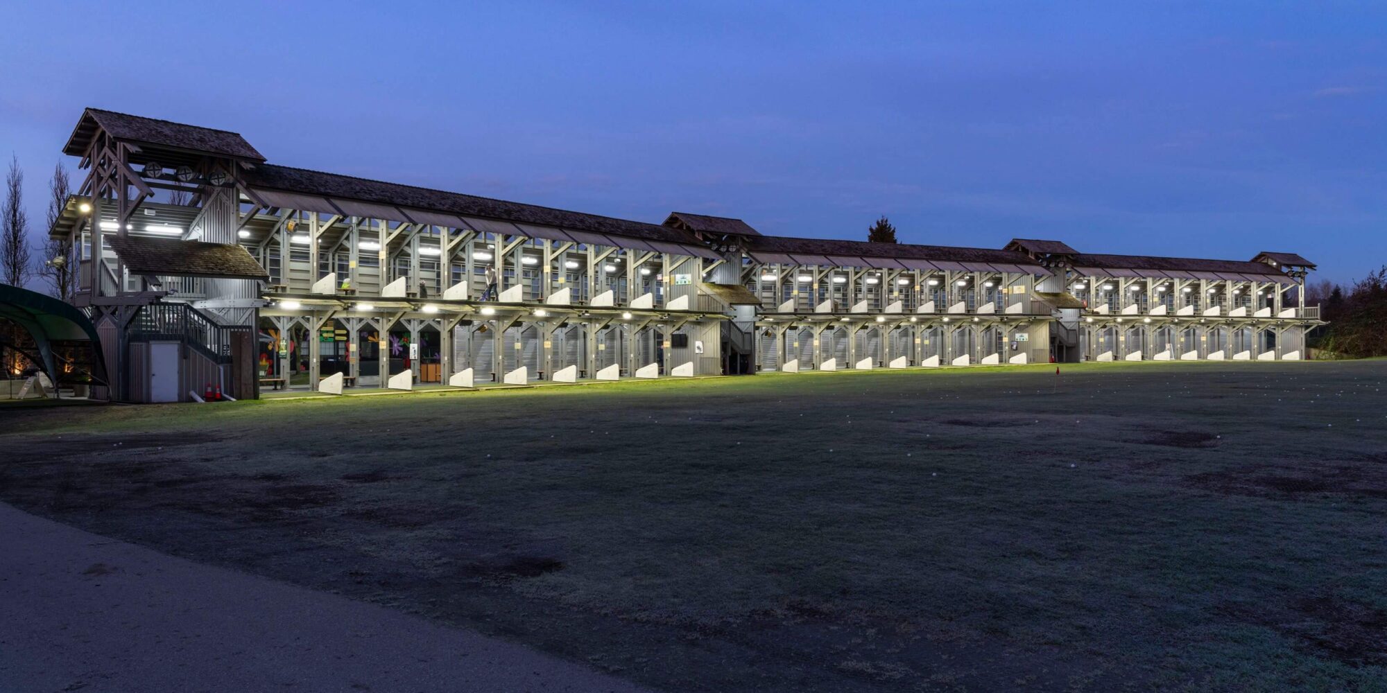 Riverway Golf Course’s two-level driving range illuminated by LED lighting at dusk