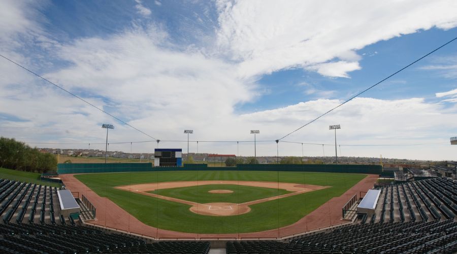 Open-air stadium with drone-proof sports netting and overhead cable structure for private airspace protection.